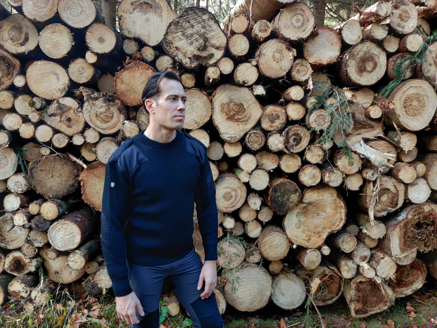 a man wearing a navy blue commando sweater