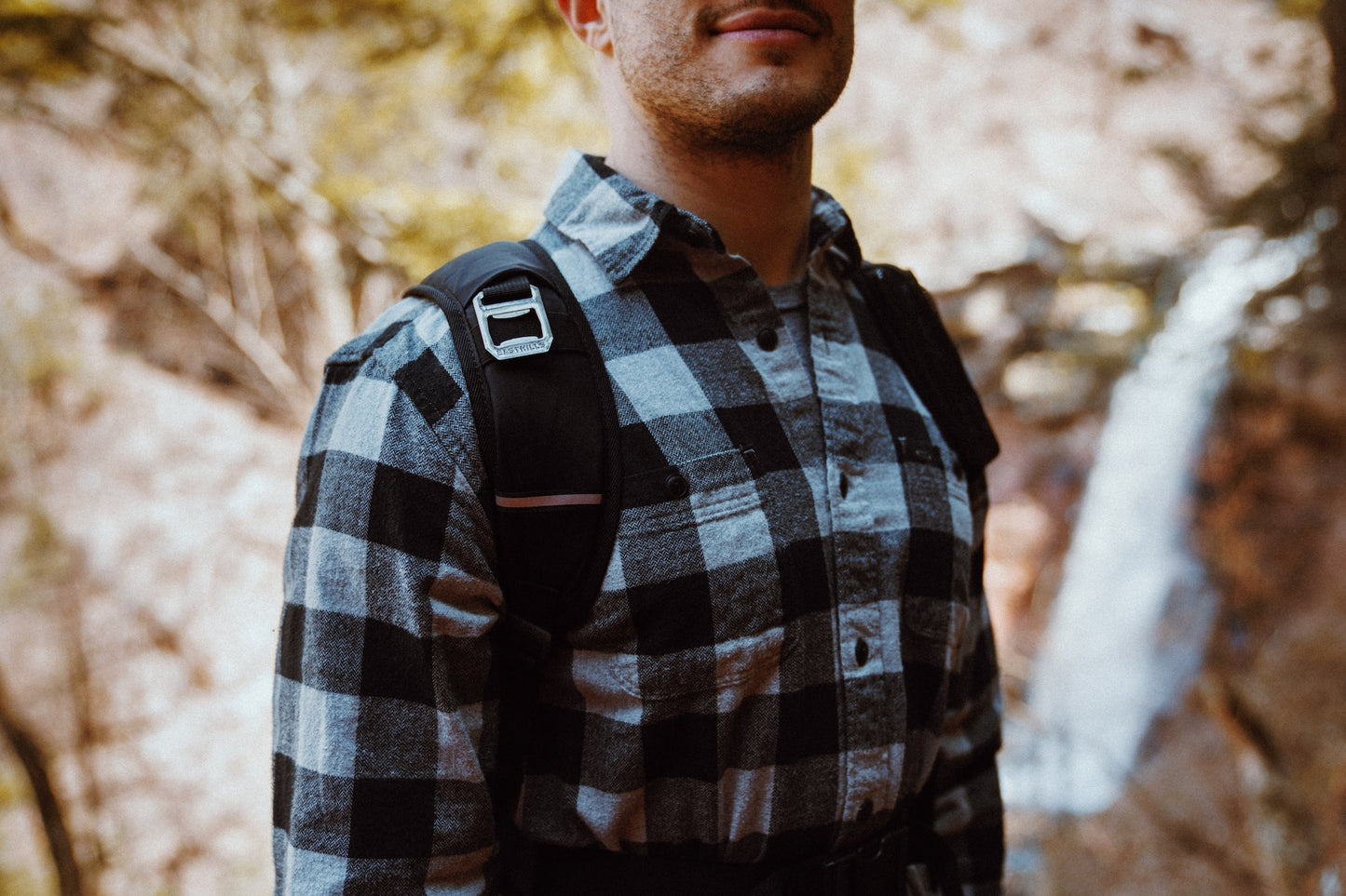 a man wearing a flannel shirt
