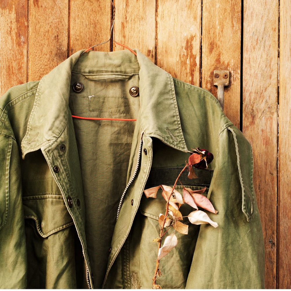 an m-51 field jacket hung up on the wall